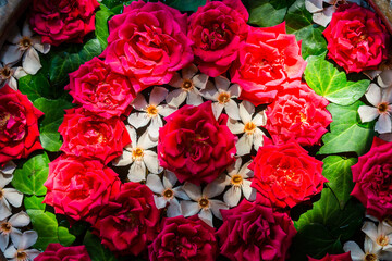 Top view of spa decor. Ball of red roses and flowers