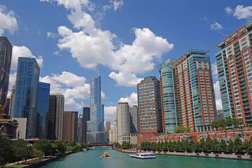 View of the Chicago skyline with tour boats on the Chicago River