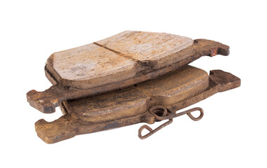 Old worn out brake pads from a car on a white background, isolate, close-up. Quality of friction...