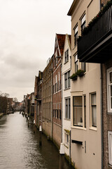 Fototapeta na wymiar canal lined with houses in the medieval town centre of Dordrecht, the Netherlands