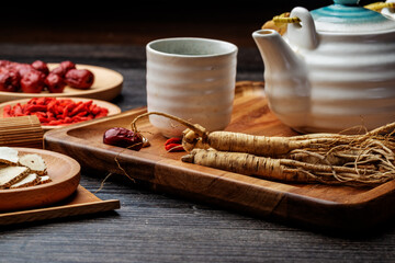 Ginseng and tea cup are on the table