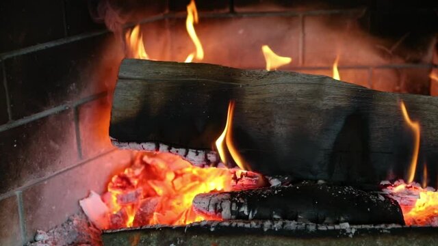 Close Up Of Burning Log And Hot Embers In Slow Motion.