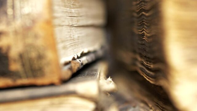 Mysterious historic books on a table in close up dynamic moving shot