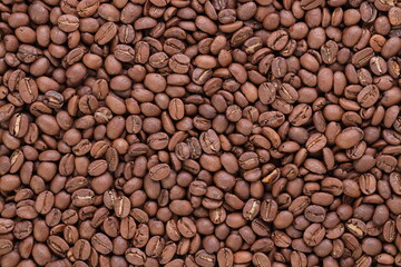 Freshly roasted coffee beans background top view using for your advertising.