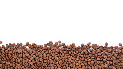Freshly roasted coffee beans background top view isolated on white background with top copy space using for your advertising