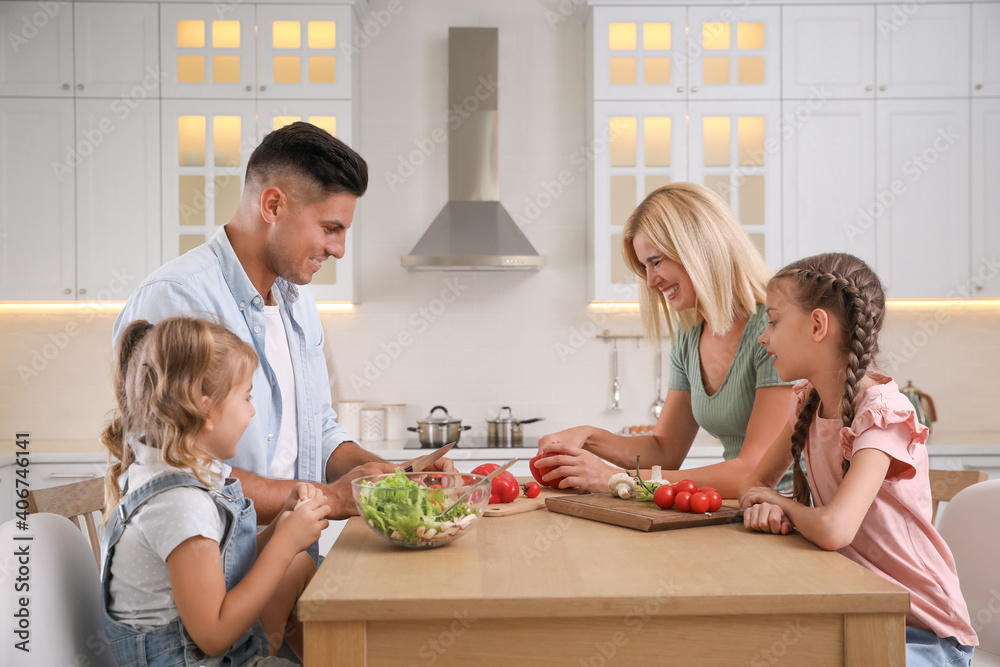 Wall mural Happy family cooking together at table in modern kitchen