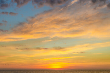 Fototapeta premium Dawn over the sea.The sun is above the water in the early morning.
