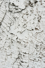 Texture of a gray wall with peeling plaster. Textured wall for background.