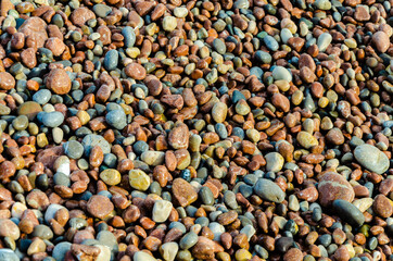 Rocks and pebbles on the sea beach.