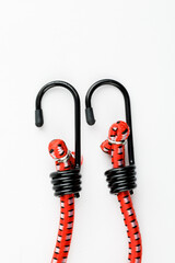 Elastic rubber rope with hook on the end on a white background
