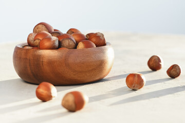 Close-up of hazelnuts on a light background.