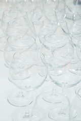 Table setting, many glass transparent glasses for wine and champagne