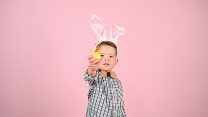 Baby with bunny ears and eggs