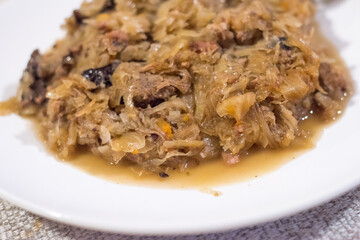 Bigos on white plate. Polish variation of Bigos.