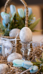 Easter card with colored eggs, gray eggs, marble pattern, spring flowers. Festive Easter background.