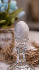 Easter card with colored eggs, gray eggs, marble pattern, spring flowers. Festive Easter background.