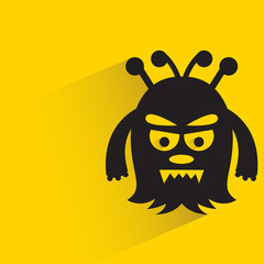 funny monster with shadow on yellow background