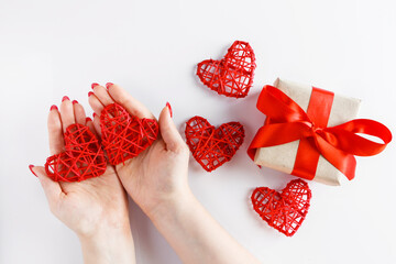 Red heart in hands on a white background