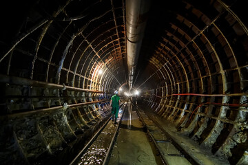 Deep underground metro tunnel. Construction of a subway line in the Dnipro city, Ukraine. August 2017