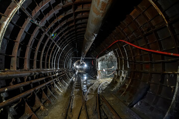 Deep underground metro tunnel. Construction of a subway line in the Dnipro city, Ukraine. August 2017
