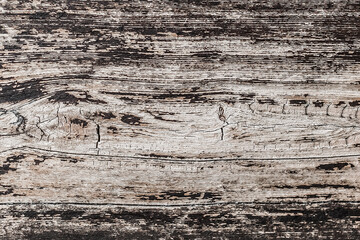 Texture of an old wooden dark scratched surface dirty black background close up