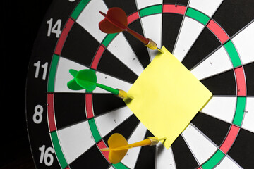 Dart darts attached to blank paper form with space for text
