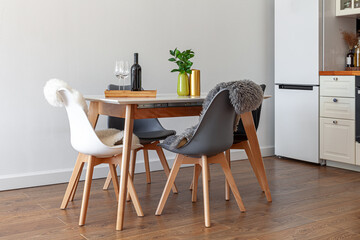Modern design interior of dining room, kitchen, white furniture