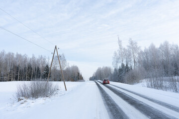 in the winter cold sunset black asphalt looks frozen