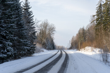 in the winter cold sunset black asphalt looks frozen