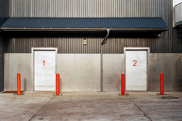 white metal doors with the number one and two on it, self storage building front, real 35mm film...