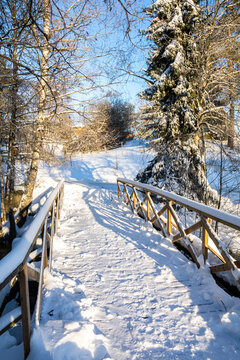 Winter view of the wooden bridge over The Kolmehaara River, Pusula, Lohja, Finland