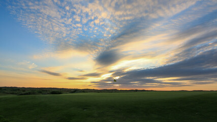 Naklejka na ściany i meble Links golf course with sunset at Texel