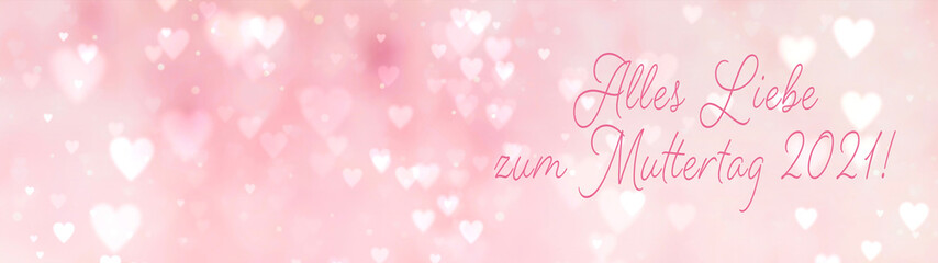 Abstract pink bokeh background banner with hearts and text in German - happy mother's day 2021 