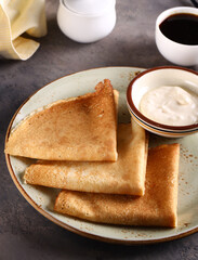 thin delicious breakfast pancakes on a plate