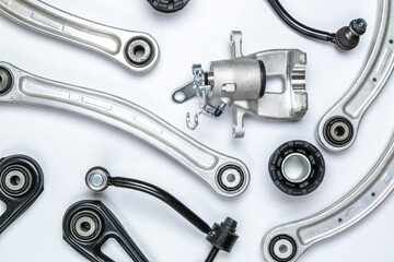 Engine gears. Auto motor mechanic spare or automotive piece on white background. Set of new metal car part. Flat lay, top view, copy space.