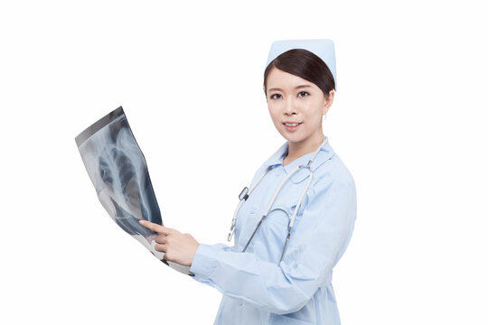Portrait of a young doctress holding X-ray