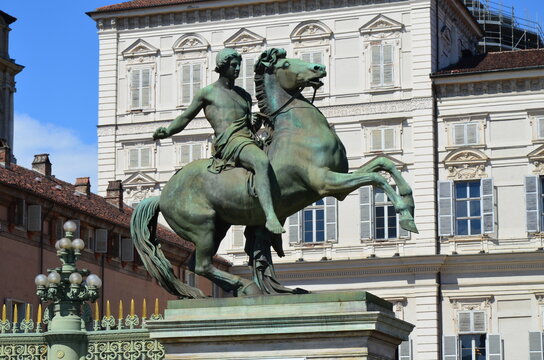 Turin – equestrian statue dedicated to Castore and Polluce in Castle square with the Royal Palace in the background