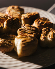 Pastry roll on plate with dramatic lighting