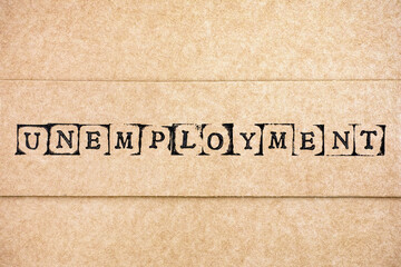 Cardboard with word Unemployment