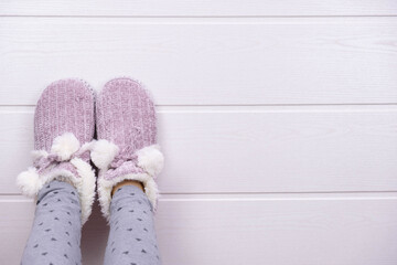 girls feet in warm slippers