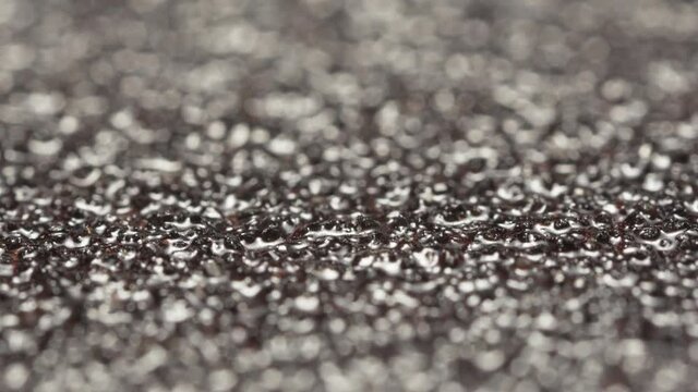 Pieces of abrasive material, black sandpaper slide shooting