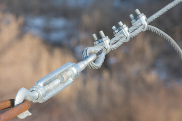 Connections of suspension structures of bridges. Fastening of iron cables with a swivel and thimble...