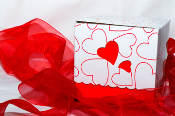 Gift box with red ribbon around