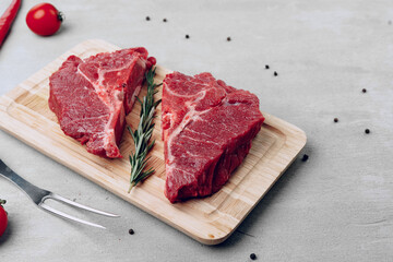 Raw beef meat fillet on wooden board