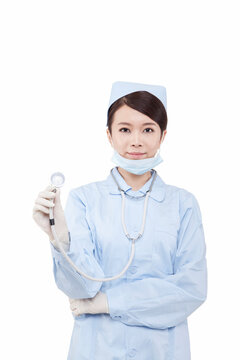 Portrait of young doctress with stethoscope holding thermometer