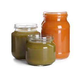 Jars with healthy baby food on white background