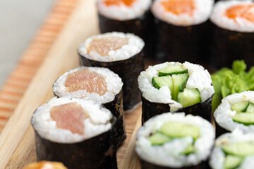 Maki sushi set served on wooden tray