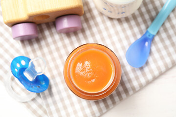 Flat lay composition with healthy baby food on white table