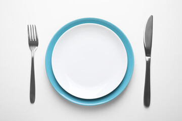 Stylish table setting on white background, top view