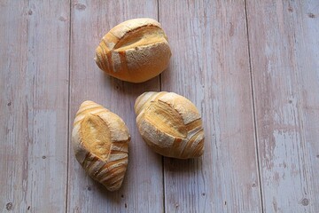 three fresh rolls, fresh, crispy bread, nicely baked wheat rolls